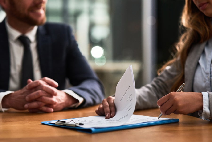 Two people going over paperwork